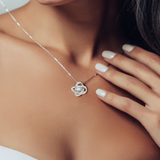 The perfect gift for your future mother in law. Brilliant 14k white gold Love Knot necklace, Zirconia crystal with smaller cubic zirconia. Includes a heartfelt message card included guaranteed to melt your new mother in laws heart.