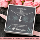 This beautiful sparkly pendant is truly is an alluring gift for your Wife, Daughter, Granddaughter, Bride To Be, Girlfriend or even for yourself. The emotions will start pouring out along with tears of joy. Comes with a Free Luxury Gift Box with the Heart Felt message as shown. The ribbon design is embellished with dainty cubic zirconia, leading your eye down to the 7mm round cut Cubic Zirconia. Crafted with 14k White Gold over Stainless Steel