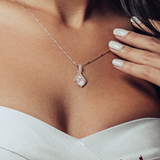 The perfect gift for mom on your wedding day.Ribbon shaped,14K white gold over stainless steel,clear crystals, a sparkling 7mm round Cubic Zirconia. Includes heartfelt message card from daughter to Mother.