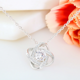 This Love Knot Necklace represents an unbreakable bond between two souls. This symbol of eternal love is a forever favorite and trending everywhere. Comes with a free luxury gift box and a message card that reads Blessed by god, spoiled by your husband. Surprise your loved one with this gorgeous gift today.14k white gold over stainless steel 6mm round cut cubic zirconia stone