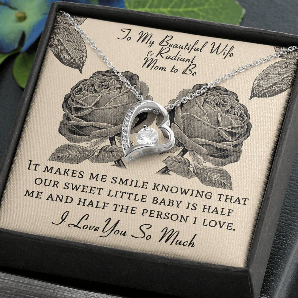 She deserves this Forever Heart Necklace Gift with heartfelt message.14k white gold over stainless steel. Zirconia crystal with smaller cubic zirconia. Message card that reads: " To my beautiful wife and radiant mom to be, It makes me smile knowing that our sweet little baby is half me and half the person I love.  I love you so much. 