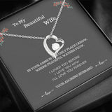 Beautiful Forever Love necklace with free gift box and heartfelt message saying To my beautiful wife, in your arms is the only place I know where peaceful waters flow. I loved you when we met, I still love you now, I'll love you forever. Love your husband. High polished heart pendant surrounding a flawless 6.5mm Cubic Zirconia, embellished with smaller Cubic Zirconia adding sparkle and shine. The pendant is available in 14k White Gold finish or 18k Yellow Gold finish
