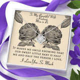The perfect gift for your wife and mom to be! Includes heartfelt message card. Brilliant 14k white gold, Zirconia crystal with smaller cubic zirconia. Message card that reads: "To my beautiful wife and radiant mom to be, It makes me smile knowing that our sweet little baby is half me and half the person I love. I love you so much.