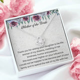 The perfect gift for your new mother in law from the groom. Brilliant 14k white gold, Zirconia crystal with smaller cubic zirconia. Includes a heartfelt message card from the groom to his new mother in law.