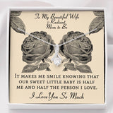 The perfect gift for your wife and mom to be.Ribbon shaped,14K white gold over stainless steel,clear crystals, a sparkling 7mm round  Cubic Zirconia.Message card that reads: "To my beautiful wife and radiant mom to be, It makes me smile knowing that our sweet little baby is half me and half the person I love. I love you so much."  