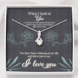 This beautiful sparkly pendant is truly is an alluring gift for your Wife, Daughter, Granddaughter, Bride To Be, Girlfriend or even for yourself. The emotions will start pouring out along with tears of joy.  Comes with a Free Luxury Gift Box with the Heart Felt message as shown.  The ribbon design is embellished with dainty cubic zirconia, leading your eye down to the 7mm round cut Cubic Zirconia.  Crafted with 14k White Gold over Stainless Steel