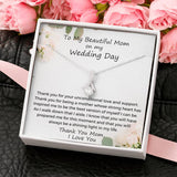 The perfect gift for mom on your wedding day.Ribbon shaped,14K white gold over stainless steel,clear crystals, a sparkling 7mm round Cubic Zirconia. Includes heartfelt message card from daughter to Mother.