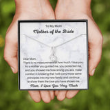 The perfect gift for mom on your wedding day.Ribbon shaped,14K white gold over stainless steel,clear crystals, a sparkling 7mm round Cubic Zirconia. Includes heartfelt message card from daughter to Mother.