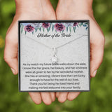 The perfect mother of the bride gift from groom. Heartfelt message card included from Groom to new Mother in law. Ribbon shaped,14K white gold over stainless steel,clear crystals,sparkling 7mm round Cubic Zirconia.
