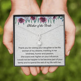 The perfect mother of the bride gift from groom. Heartfelt message card included from Groom to new Mother in law. Ribbon shaped,14K white gold over stainless steel,clear crystals,sparkling 7mm round Cubic Zirconia.
