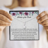 The perfect mother of the bride gift from groom. Heartfelt message card included from Groom to new Mother in law. Ribbon shaped,14K white gold over stainless steel,clear crystals,sparkling 7mm round Cubic Zirconia.