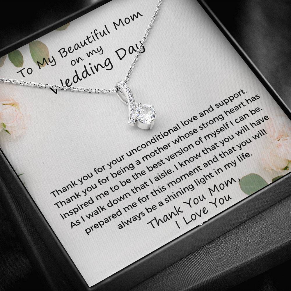 The perfect gift for mom on your wedding day.Ribbon shaped,14K white gold over stainless steel,clear crystals, a sparkling 7mm round Cubic Zirconia. Includes heartfelt message card from daughter to Mother.