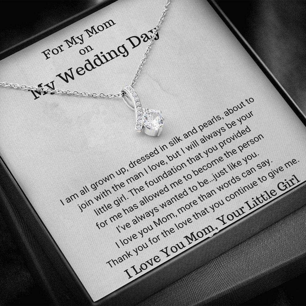 The perfect gift for mom on your wedding day.Ribbon shaped,14K white gold over stainless steel,clear crystals, a sparkling 7mm round Cubic Zirconia. Heartfelt Message Card included.