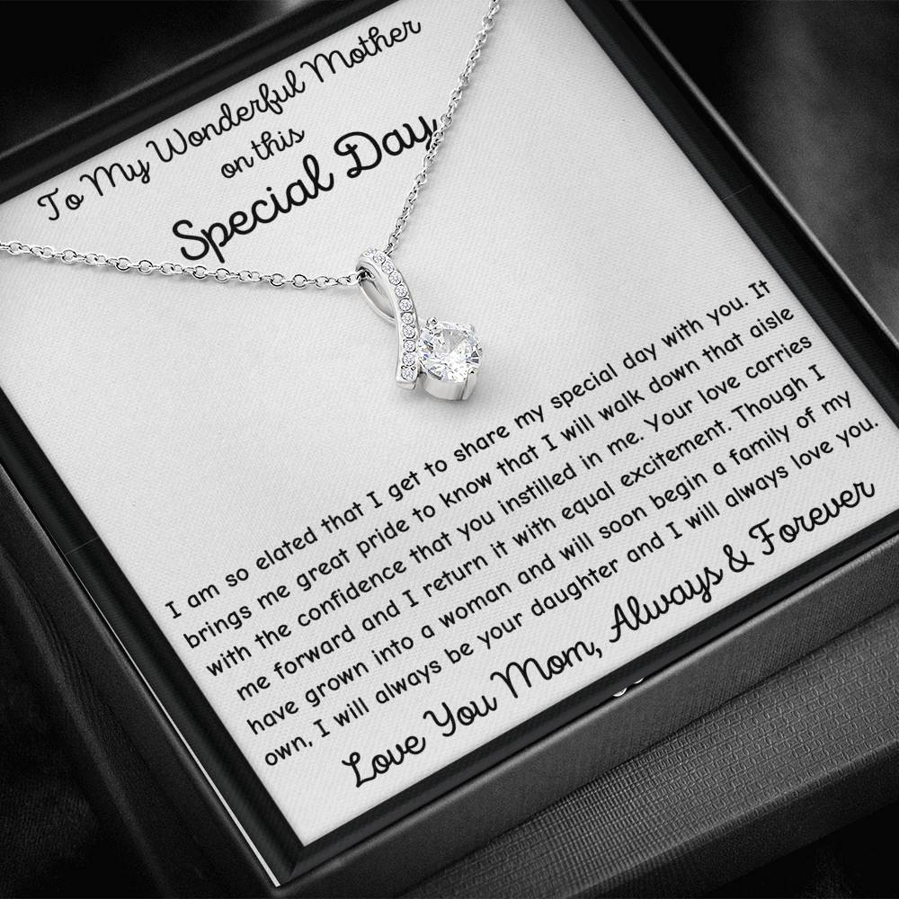 The perfect gift for mom on your wedding day.Ribbon shaped,14K white gold over stainless steel,clear crystals, a sparkling 7mm round Cubic Zirconia. Includes heartfelt message card from daughter to Mother.
