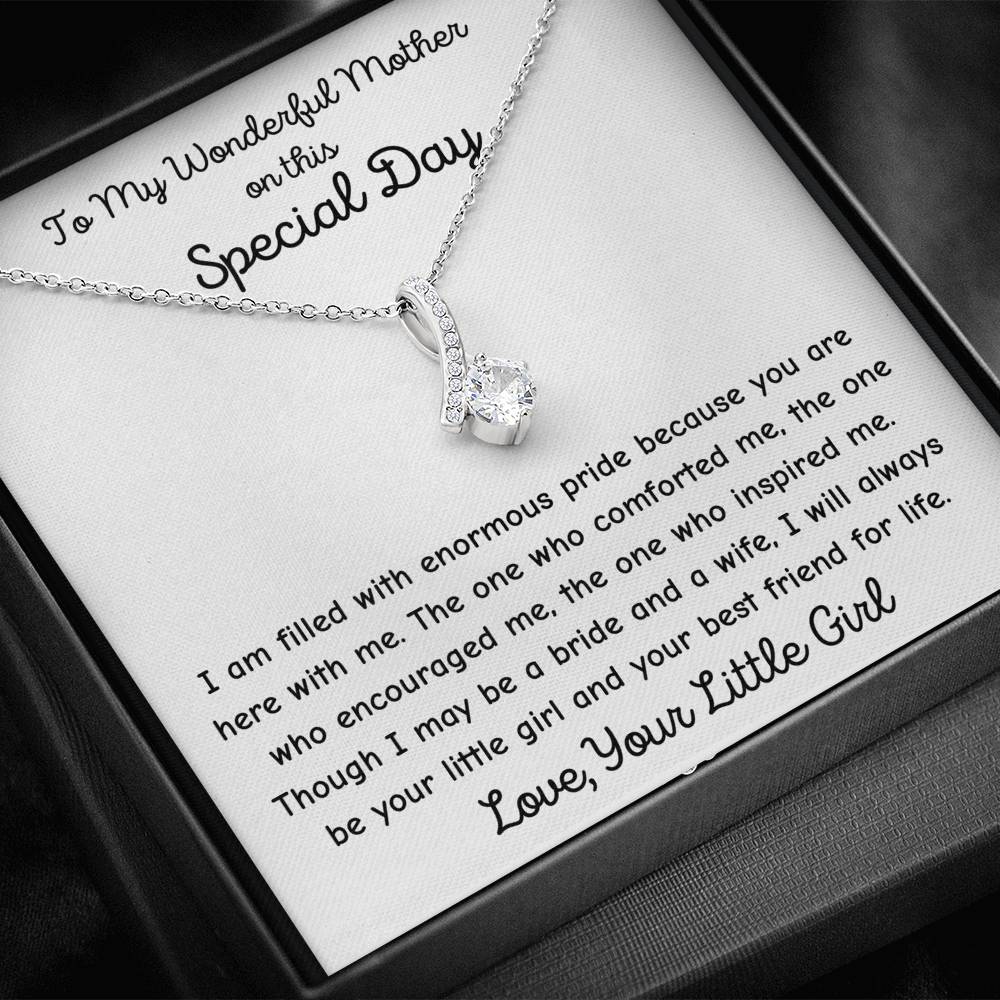 The perfect gift for mom on your wedding day.Ribbon shaped,14K white gold over stainless steel,clear crystals, a sparkling 7mm round  Cubic Zirconia. 