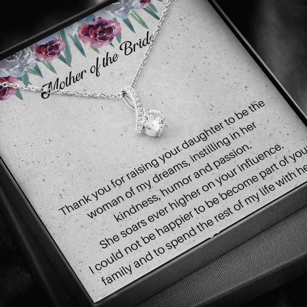 The perfect mother of the bride gift from groom. Heartfelt message card included from Groom to new Mother in law. Ribbon shaped,14K white gold over stainless steel,clear crystals,sparkling 7mm round Cubic Zirconia.