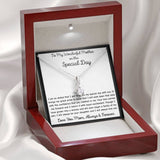 The perfect gift for mom on your wedding day.Ribbon shaped,14K white gold over stainless steel,clear crystals, a sparkling 7mm round Cubic Zirconia. Includes heartfelt message card from daughter to Mother.
