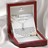 The perfect gift for mom on your wedding day.Ribbon shaped,14K white gold over stainless steel,clear crystals, a sparkling 7mm round Cubic Zirconia. Includes heartfelt message card from daughter to Mother.