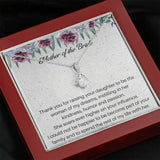 The perfect mother of the bride gift from groom. Heartfelt message card included from Groom to new Mother in law. Ribbon shaped,14K white gold over stainless steel,clear crystals,sparkling 7mm round Cubic Zirconia.