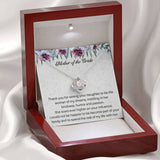 The perfect gift for your new mother in law from the groom. Brilliant 14k white gold, Zirconia crystal with smaller cubic zirconia. Includes a heartfelt message card from the groom to his new mother in law.